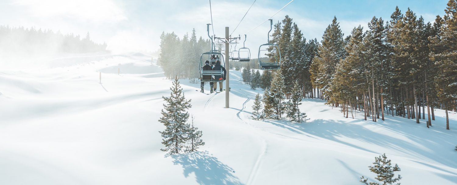 People on ski lift at ski resort in the winter